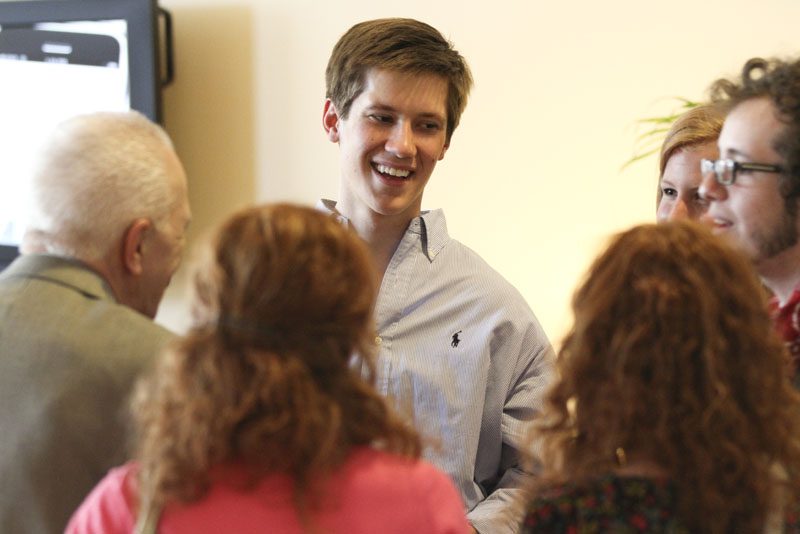 Walker Stinnette and other Hollingsworth and Townes students gathered around Richard Benedetto to hear his plethora of stories