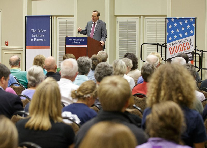 Jeffrey Brown speaking to a full house