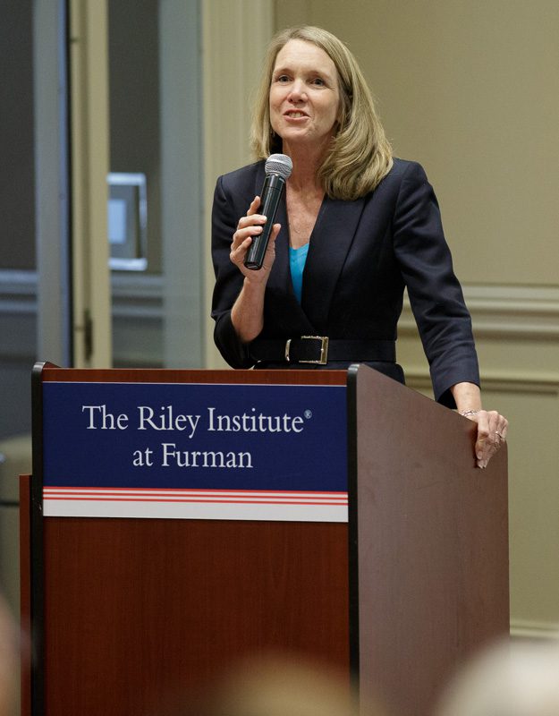 Jill Fuson, manager of conferences and policy events at the Riley Institute at Furman, welcoming guests to the 4th and final session of the 2012 Summer Series program