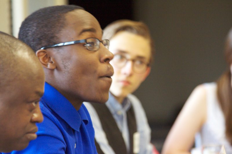 Jonathan Kubakundimana '16 (home country Rwanda) speaking, in the foreground Kolawole Olaiya, background Ben Riddle '16 from Greenville