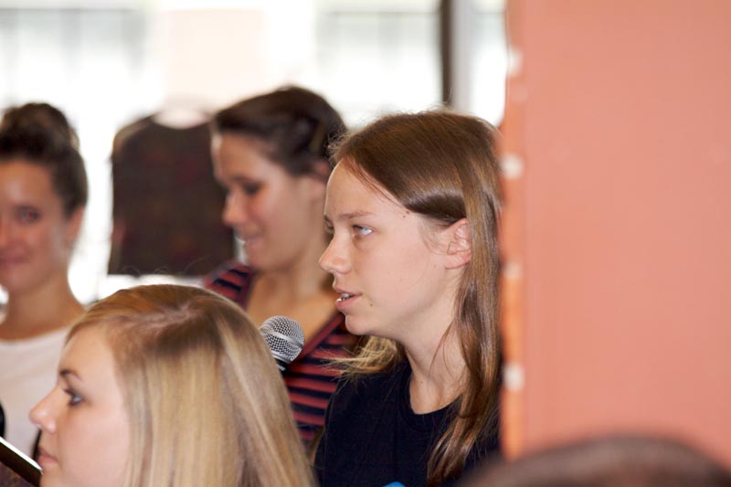 Student asking questions of the panelists