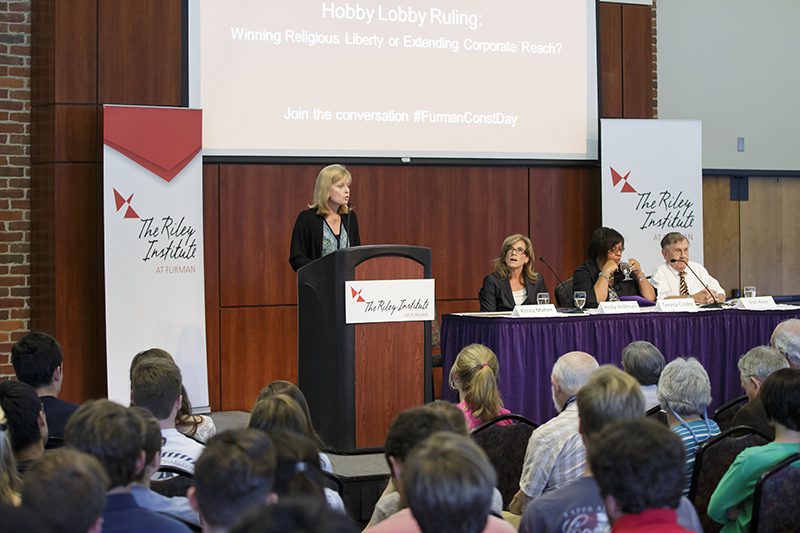 Furman professor of sociology Kristy Maher introducing Holly Hollman