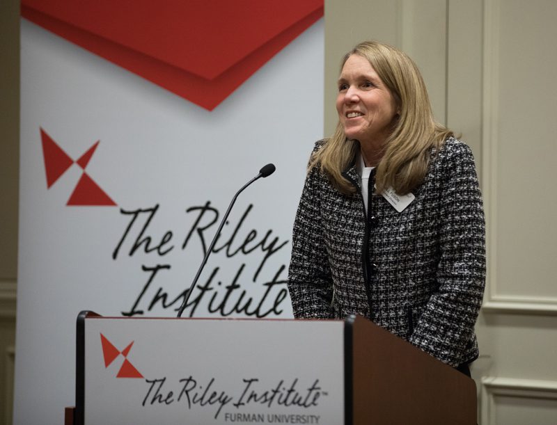 Jill Fuson, Assistant Director of the Riley Institute, welcoming Nick Galasso and students