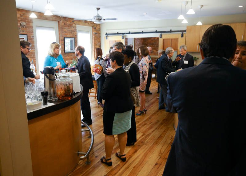 Guests mingling with the ten Furman alumni, who returned to speak at the two-day symposium, 