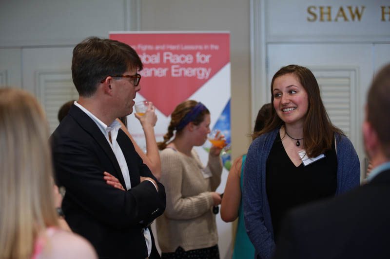 Jeffrey Ball engaging with student scholars at a reception