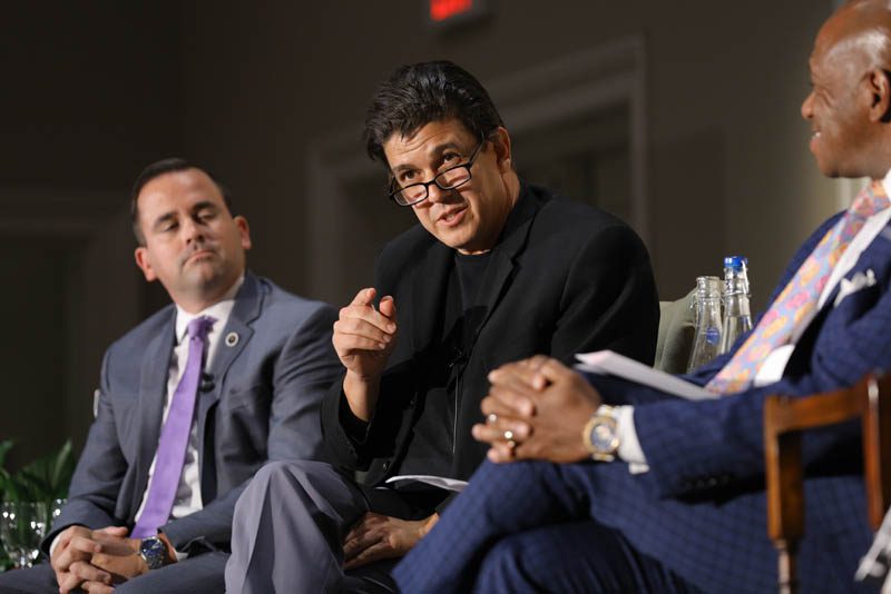 (l-r) Neal Collins, Akan Malici speaking and Garry McFadden