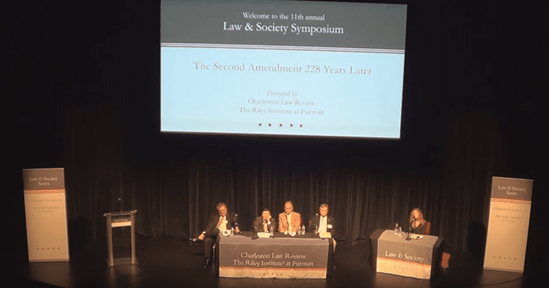 Panel discussion moderated by Allyson Haynes Stuart; panelists include Saul Cornell, Adam Samaha, Stephen Halbrook and William Merkel