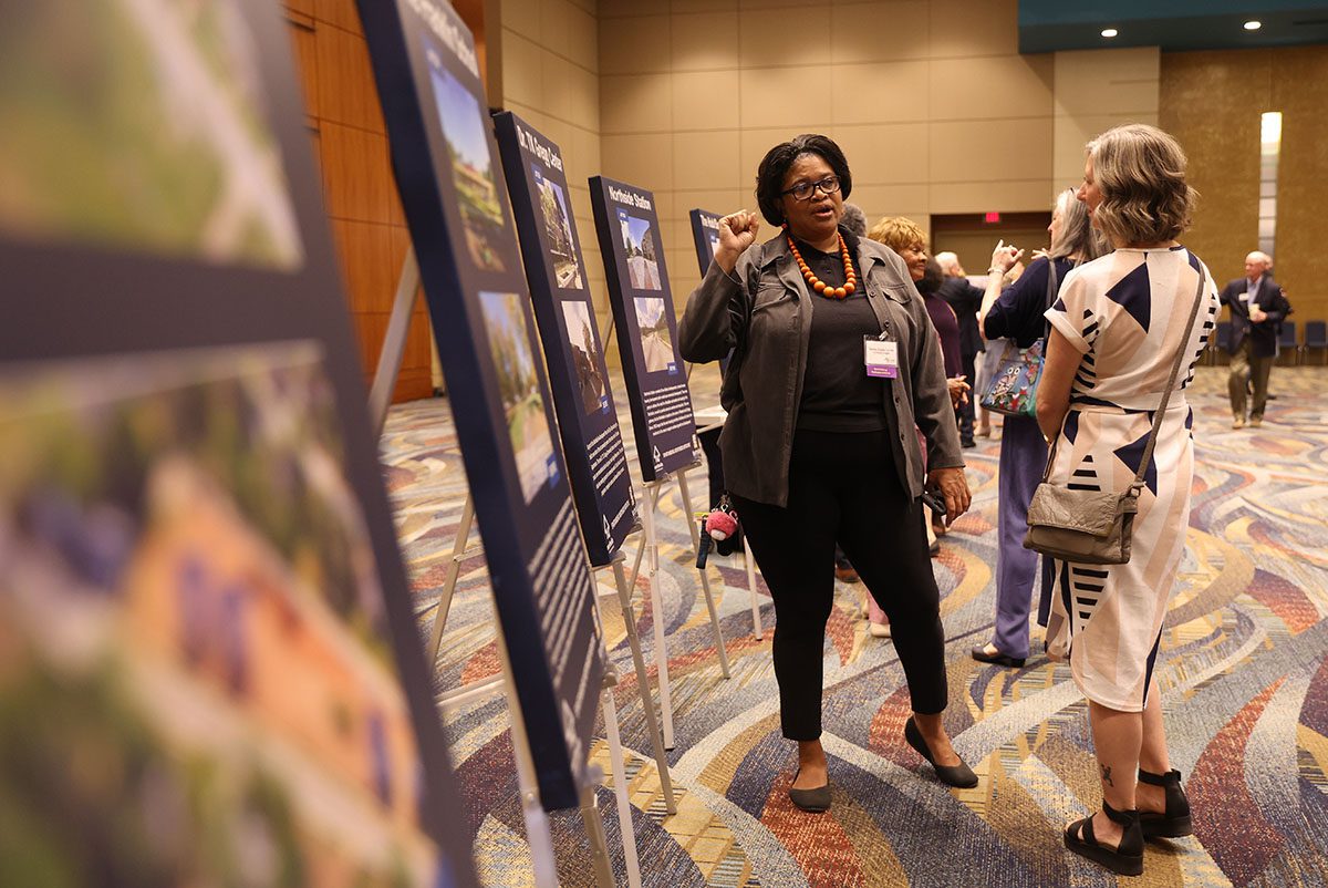 Wanda Cheeks Holmes, a long-time community activist in Spartanburg, speaks to eventgoer about the initiative. 