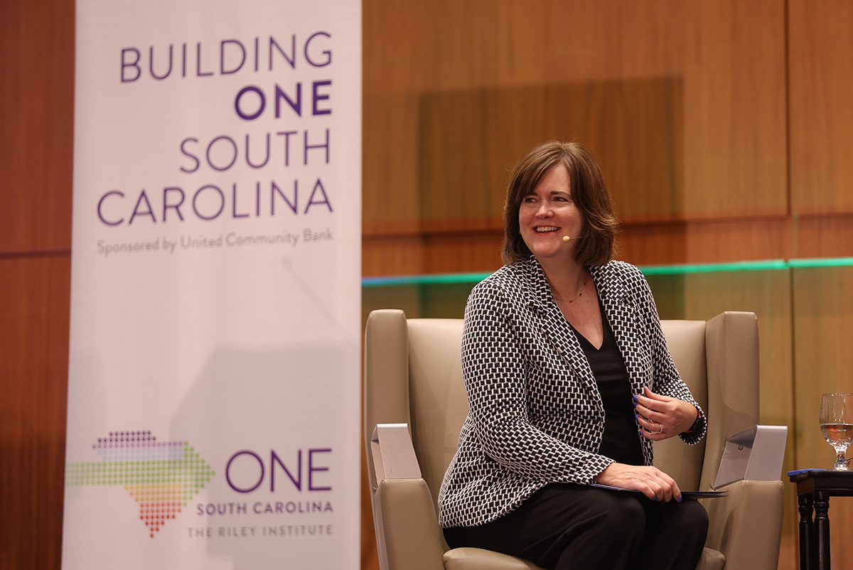 Carol Naughton, president of Purpose Built Communities, moderates a panel about creating an opportunity infrastructure. 