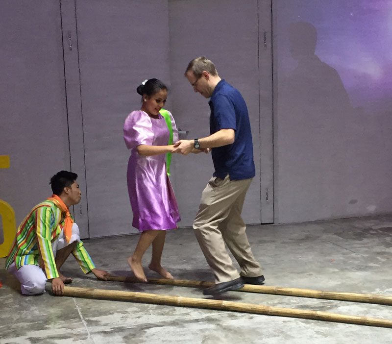 Economics professor Dr. Jason Jones participates in another group's cultural night presentation.
