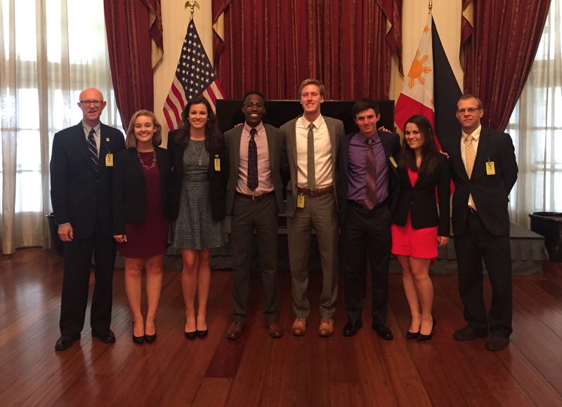 The U.S. delegation is pictured at the U.S. embassy in Manila, in the room where Japanese General Yamashita was tried after WWII.