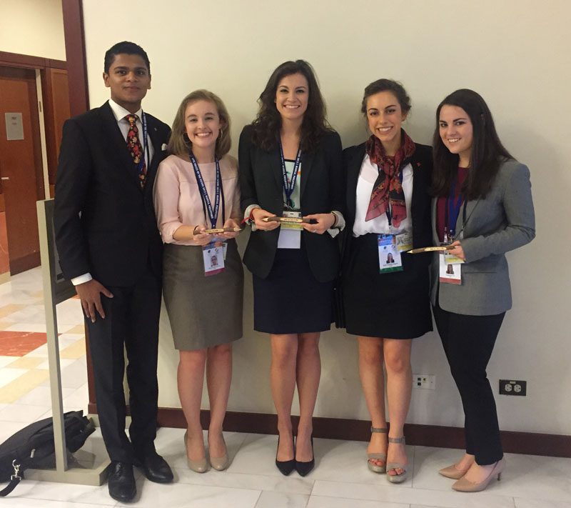 Students Gray Johnson, Mallary Taylor, and Kelsey Orr are pictured with friends from the Canadian delegation.
