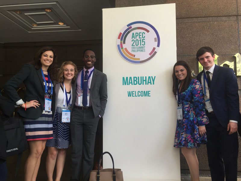 Members of the U.S. delegation get ready to walk into the Makati Shangri-La, where the APEC CEO Summit was held