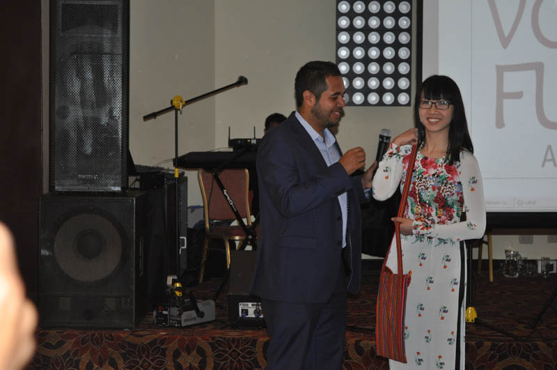 A symbolic handover from Jorge Antonio Chavez Mazuelos, Representative of the APEC Voices of Peru to Tien Thuy Hoang, Representative of the APEC Voices of Vietnam, host of the APEC Voices 2017