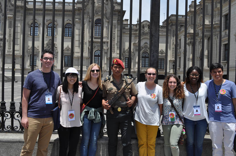 The Furman contingent with one of the Government Palace guards (l-r) John Bleed, Tien Thuy Hoang, Julia Reynolds, guard, Emilee O'Brien, London Anderson and Crystal Brockington